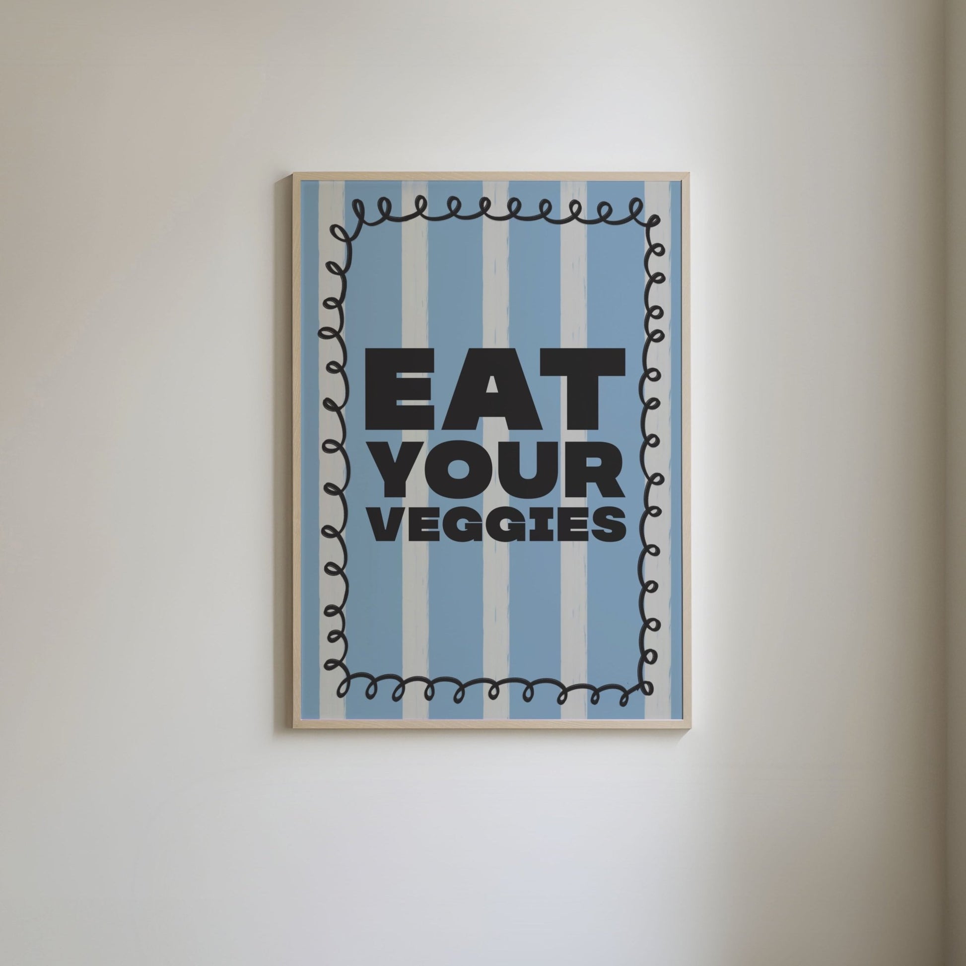 Art print with a blue and white striped background, featuring bold grey text 'Eat Your Veggies' and a squiggly grey border.