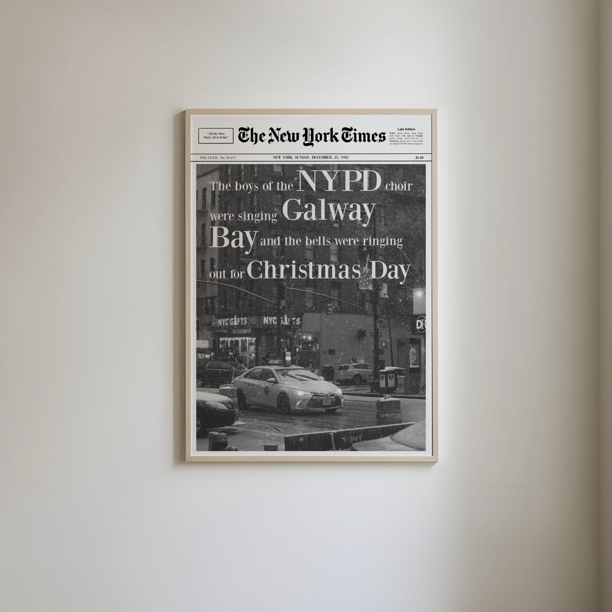 Newspaper-style art print featuring Christmas song lyrics from 'Fairytale of New York,' with a black and white photo of a New York taxi on snow-covered streets, capturing a wintry New York scene.