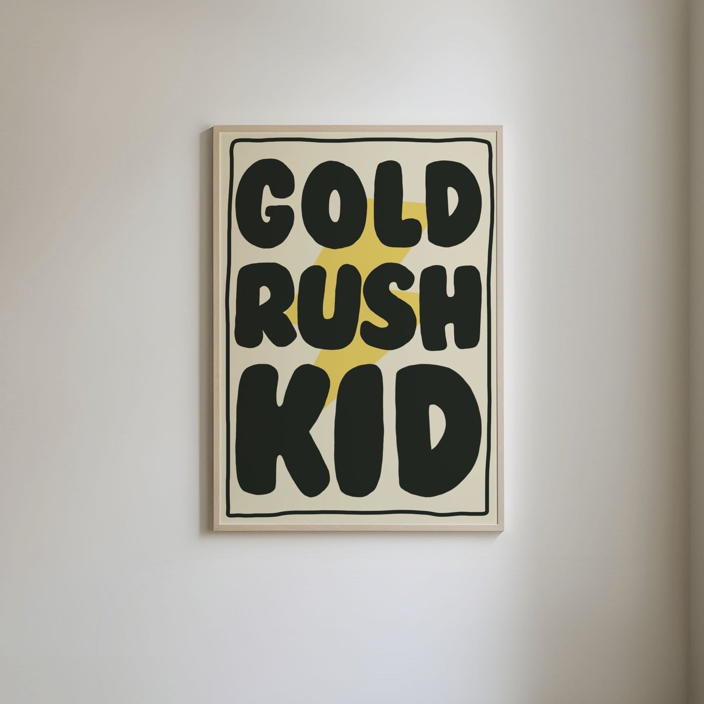 Art print with a pale yellow background, featuring a bright yellow lightning bolt underneath bold black text 'Gold Rush Kid,' framed by a thin black border.