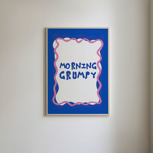 Art print with a blue border and pink squiggly line, featuring fun blue typography that reads 'Morning Grumpy.