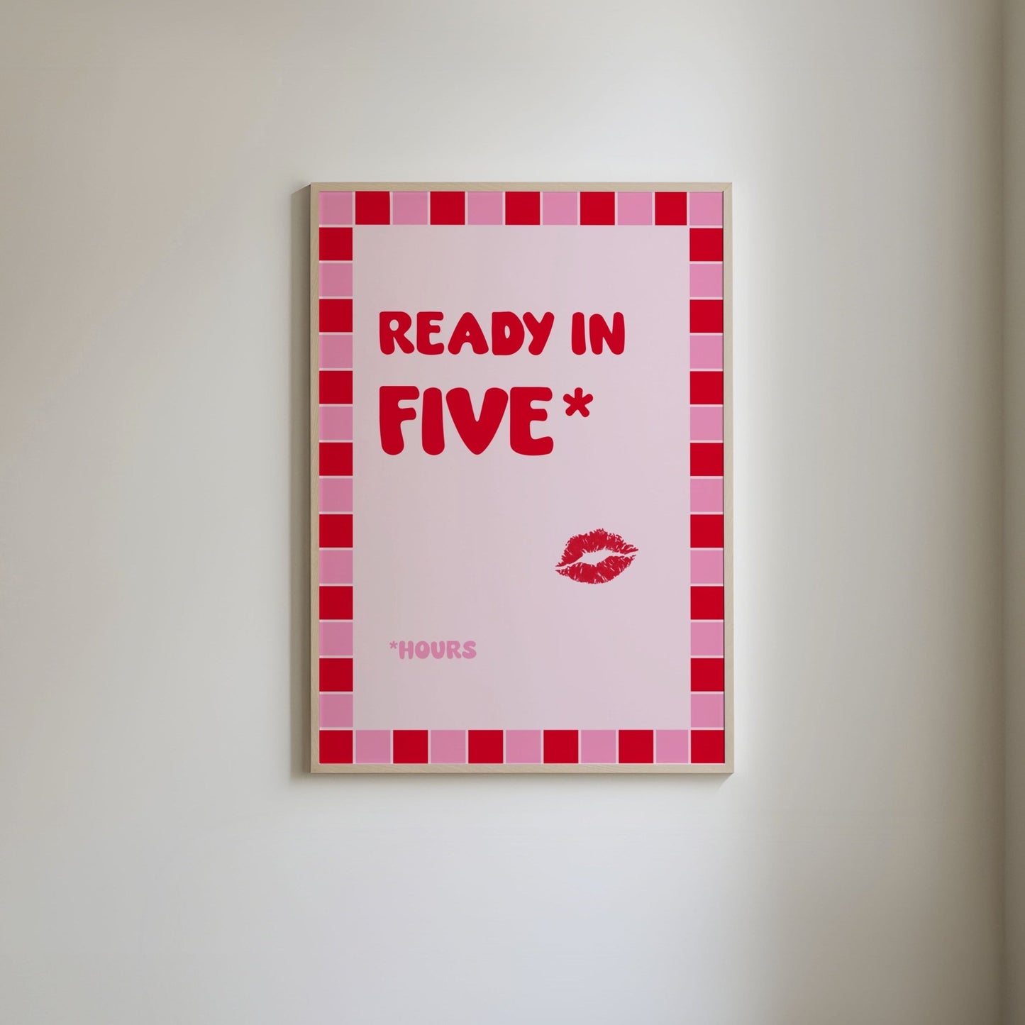 Art print with a pink and red square border, featuring bold red text 'Ready in 5*' and below in pink the word '*hours' below and a red lipstick stain illustration.