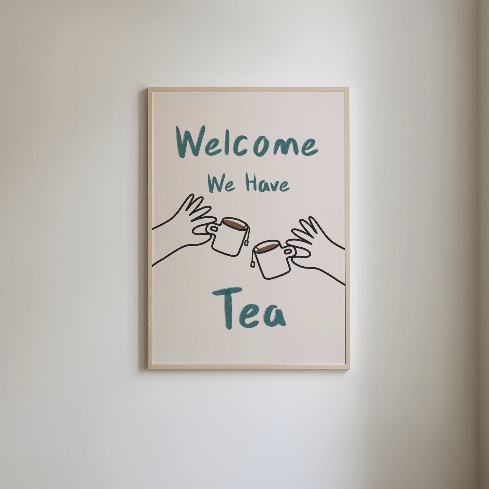 Art print with 'Welcome, we have tea' in green hand written style text and hand-drawn illustrations of hands holding mugs of tea with tea bags hanging over the side.