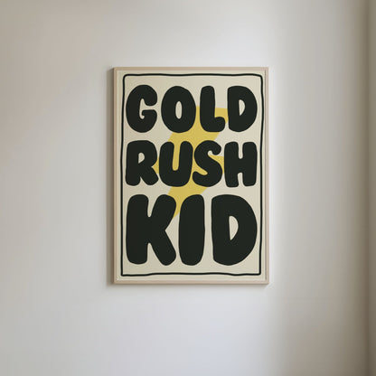 Art print with a pale yellow background, featuring a bright yellow lightning bolt underneath bold black text 'Gold Rush Kid,' framed by a thin black border.