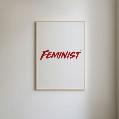 Simple red typography of the word 'feminist' on a white background.